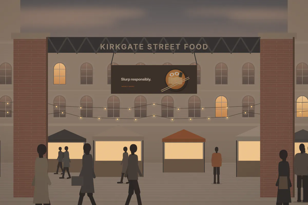 Banner pitch at a weekend street-food market — at dusk